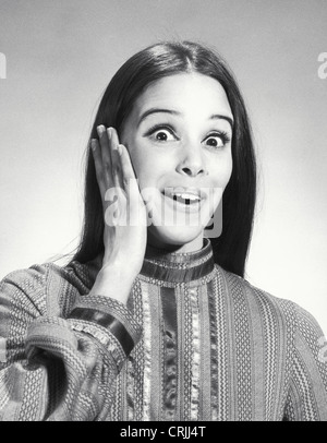 Young woman looking surprised Stock Photo