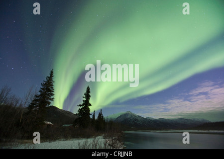 Aurora borealis dance in the sky over the Middle Fork of the Koyukuk River, Brooks Range, above the Arctic Circle, Alaska Stock Photo