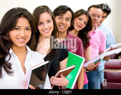 casual group of students lead by a female student Stock Photo