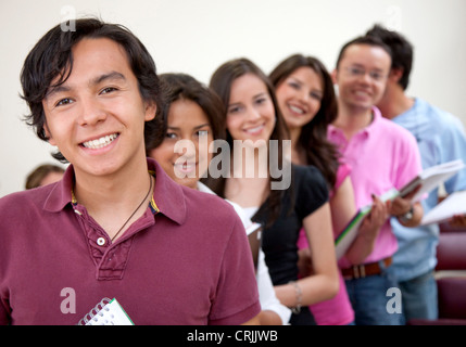 casual group of students lead by a female student Stock Photo