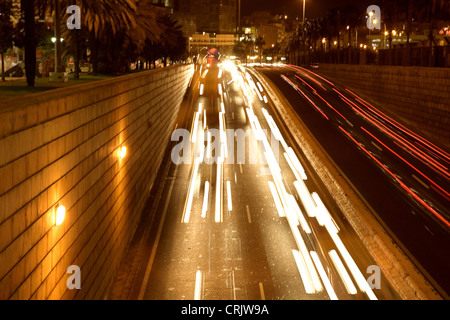 moving traffic at night with moving lights, United Kingdom, England Stock Photo