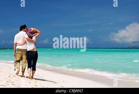 couple in love walking at the sea Stock Photo