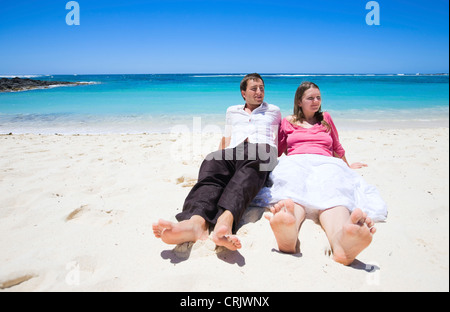Young happy couple on white sand beach, Mauritius, Indian Ocean Stock Photo