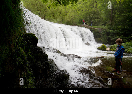 Little boys looking at Monsal Dale Weir a popular tourist spot in the Peak District Derbyshire England Stock Photo