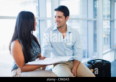 Business people talking in lobby Stock Photo