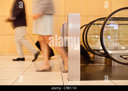 Blurred view of business people in lobby Stock Photo