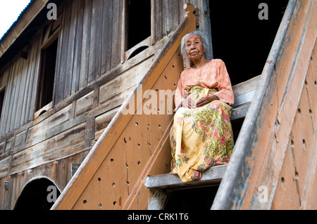 woman at long rumah minangkabau sulit air village bukittingi sumatra indonesia