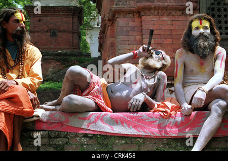 Three Sadhus in Pashupatinath Temple in Nepal Stock Photo