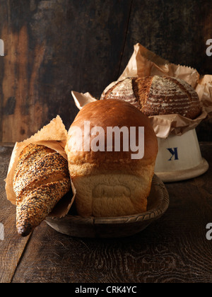 Freshly baked breads in bowls Stock Photo