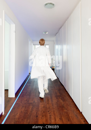 Doctor walking in hallway Stock Photo