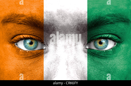 Human face painted with flag of Ivory Coast Stock Photo