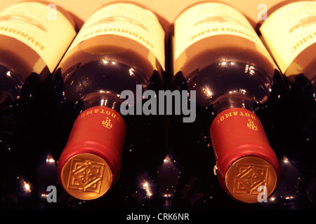 Wine bottles in the cellar of the skete of Mylopotamos, Mount Athos, Greece. Stock Photo