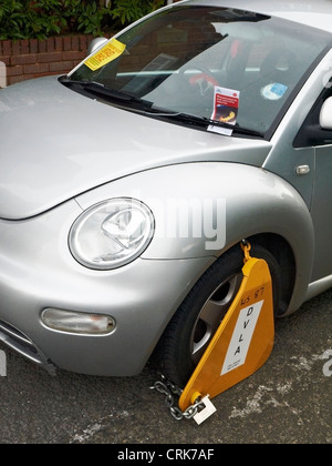 Car clamped on untaxed vehicle in Sandbach Cheshire by DVLA Stock Photo