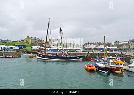 A general view of Portsoy Harbour during the the 19th Scottish Traditional Boat Festival held this year in wet weather Stock Photo