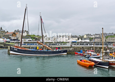 A general view of Portsoy Harbour during the the 19th Scottish Traditional Boat Festival held this year in wet weather Stock Photo