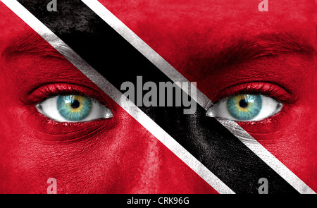 Human face painted with flag of Trinidad and Tobago Stock Photo