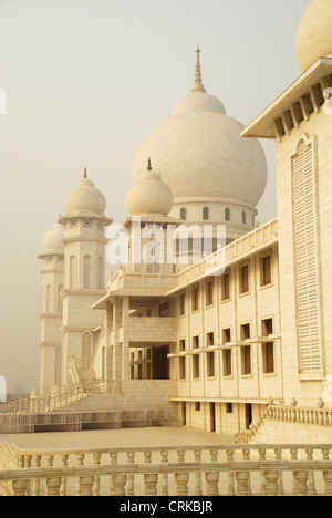 Partial view of Jai Gurudev temple, Fully constructed in white marble Stock Photo