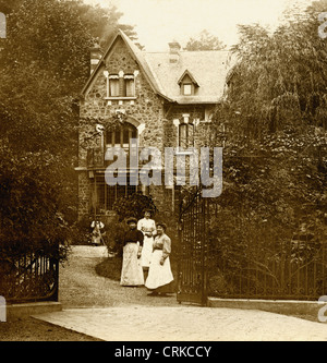 Household Staff in front of French Victorian Villa Stock Photo