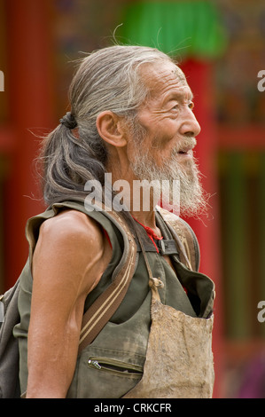 Portrait of an elderly chinese Bhuddist pilgrim at the the Labrang Monastery complex in Xiahe. Stock Photo