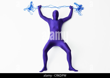 Man in bodysuit posing with string Stock Photo