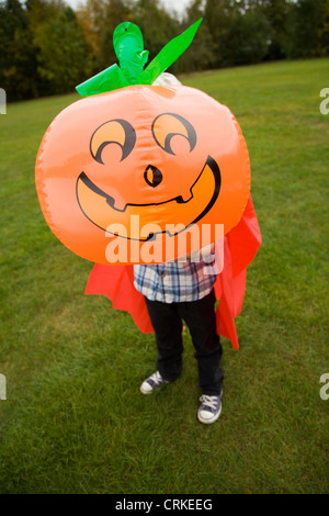 Boy playing with jack oí lantern Stock Photo