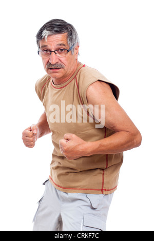 Confident sporty senior man posing, isolated on white background. Stock Photo