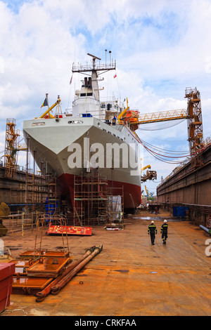 A large cargo ship is being renovated in shipyard Gdansk, Poland. Stock Photo