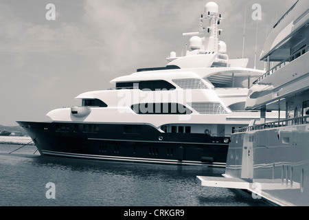 Luxury yachts in port, digitally retouched and toned photo. Stock Photo