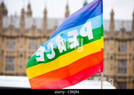 A peace flag at a protest camp outside the Houses of Parliament, London, UK. Stock Photo