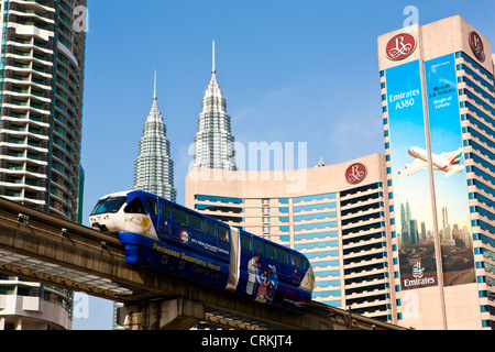 Monorail at Kuala Lumpur with Petronas Twin Towers in background, Malaysia Stock Photo