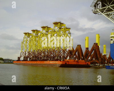 Steel jackets for offshore wind energy production on a barge without own propulsion in the port of Bremerhaven. Stock Photo