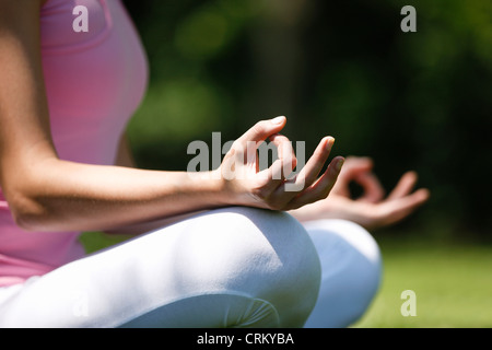 A young woman meditating outside, close up Stock Photo