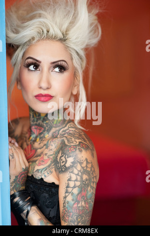 Young blond woman, tattooed Stock Photo - Alamy