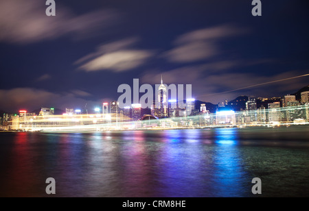 Cruise ship passing Victoria harbor at night in Hong Kong Stock Photo