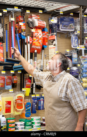 Mature salesperson working in hardware store Stock Photo