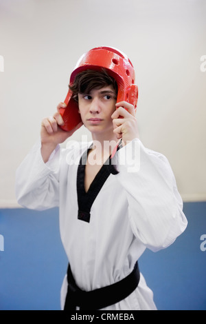 Teenage boy wearing protective headgear in practice session Stock Photo