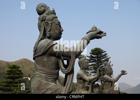 It's a photo of a Big buddha in Hong Kong on Lantau island. Its name is Tian Tan Buddha. It is very popular and touristic Stock Photo