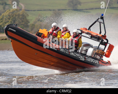 Speed power rigid inflatable boat Nith Inshore Rescue independent lifeboat practising just of Glencaple UK Stock Photo