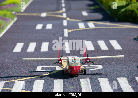 Lego plane taxing on the runway at the airport of Miniland, Legoland, Billund, Denmark Stock Photo