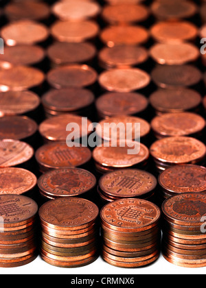 Neat piles of British pennies Stock Photo