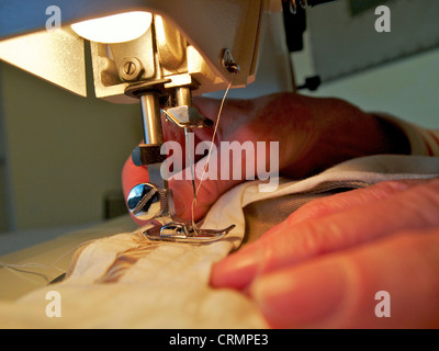 Sewing using a sewing machine Stock Photo