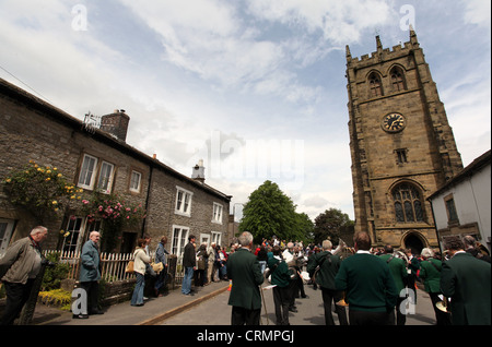 The Village Band Marching Through the Derbyshire Village of Youlgreave for the Blessing of the Well Dressings Stock Photo