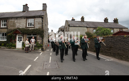 The Village Band Marching Through the Derbyshire Village of Youlgreave for the Blessing of the Well Dressings Stock Photo