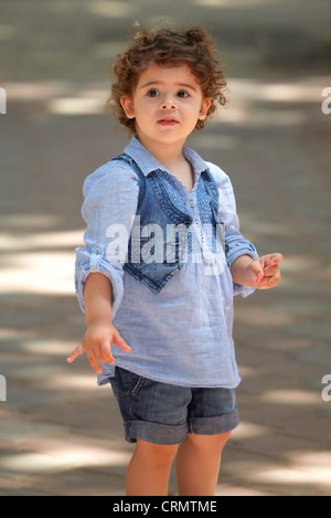 Portrait of happy two year old little girl outdoor. Stock Photo