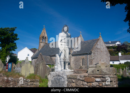 St Cattwg's Church with Lifeboatmen Memorial in foreground Port Eynon Gower Peninsula Swansea County South Wales UK Stock Photo