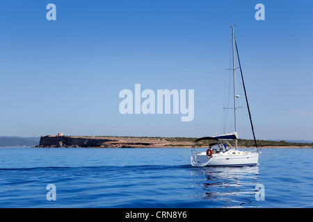 Espalmador in Formentera island with sailboat in Mediterranean calm water Stock Photo