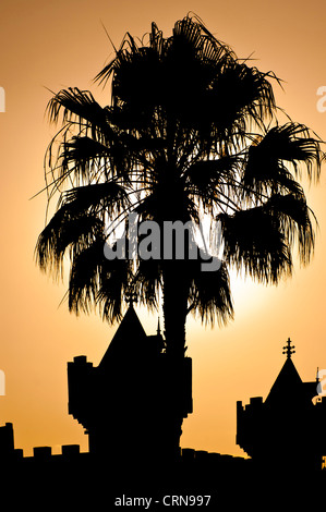 LAS VEGAS, USA - JUNE 16, 2012:    Palm Tree Silhouette beside Excalibur Hotel Stock Photo