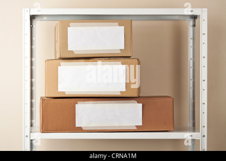Cardboard boxes with blank labels. Moving, storage concept. Stock Photo