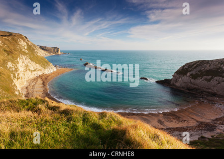 Man O' War Bay on the Jurassic Coast, part of St Oswald's Bay. The rocks in the sea are said to look like war ships. Stock Photo