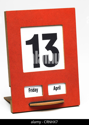 A desk calendar showing Friday 13 April Stock Photo